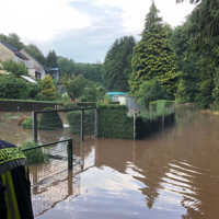 Überflutete Wege und Gärten in Olewig nach dem Starkregen im Juli 2019