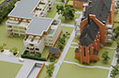 Der Blick auf das Modell des Architekturbüros Beckhäuser zeigt die Anordnung der neuen Wohngebäude (links) auf dem Klostergelände in Olewig. Im Zusammenspiel mit dem Altbau (rechts) entsteht ein quadratischer Innenhof.