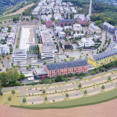 Die Fotomontage zeigt die Lage des geplanten Parkplatzes (im Vordergrund) am Wissenschaftspark. Vorgesehen sind bis zu 192 Stellplätze. Abbildung: Stadtplanungsamt