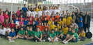 Die jungen Leichtathleten aus vier Ländern beim Wettbewerb in Luxemburg. Die Trierer präsentierten sich in leuchtend orangefarbenen Shirts.. Foto: Schulverwaltungsamt