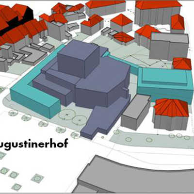 Die Grafik zeigt, was am Augustinerhof möglich wäre: Ein Winkel-Anbau entlang des Heinz-Tietjen-Wegs und am Augustinerhof sowie eine Kammerspielbühne an der Hindenburgstraße. Verbunden wären die Gebäude durch eine Art Brücke. 
Grafik: Theapro