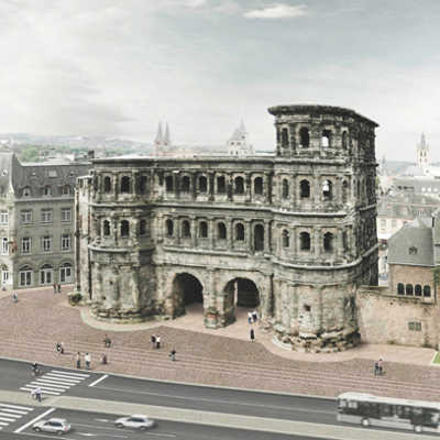 Visualisierung des Siegerentwurfs: Der Blick über die Nordallee zur Porta Nigra zeigt, wie sich der Umrisse des römischen Stadttors in der unterschiedlichen Pflasterung des Platzes abzeichnet. Abb.: Atelier Loidl